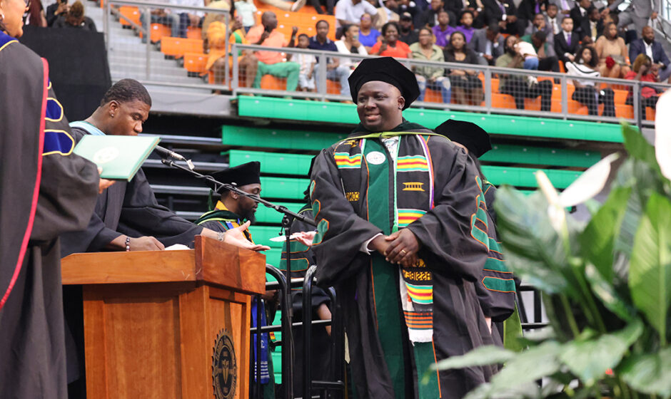 Michael Kosak Osei Assibey receives his degree at the 2024 Spring Commencement Ceremony.(Credit: James Moran)