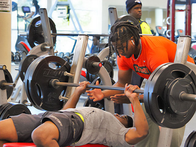 Students lifting weights