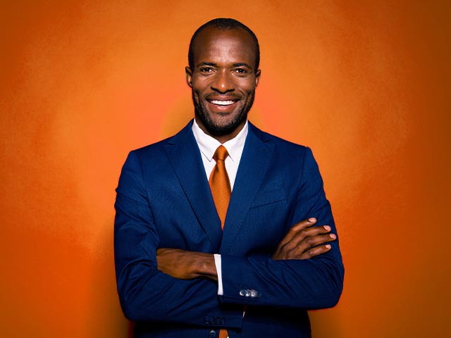 Manager in suit with orange tie