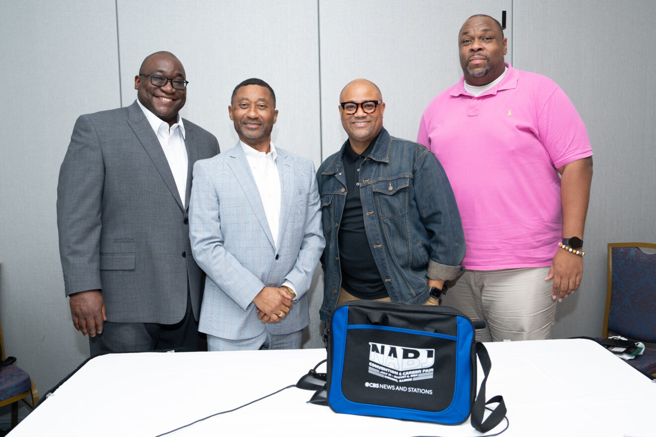 (from left) Alumni Leon Tucker, (third from left) Rod Carter and (fourth from left) Marlon A. Walker. (credit: Christian Whitaker)