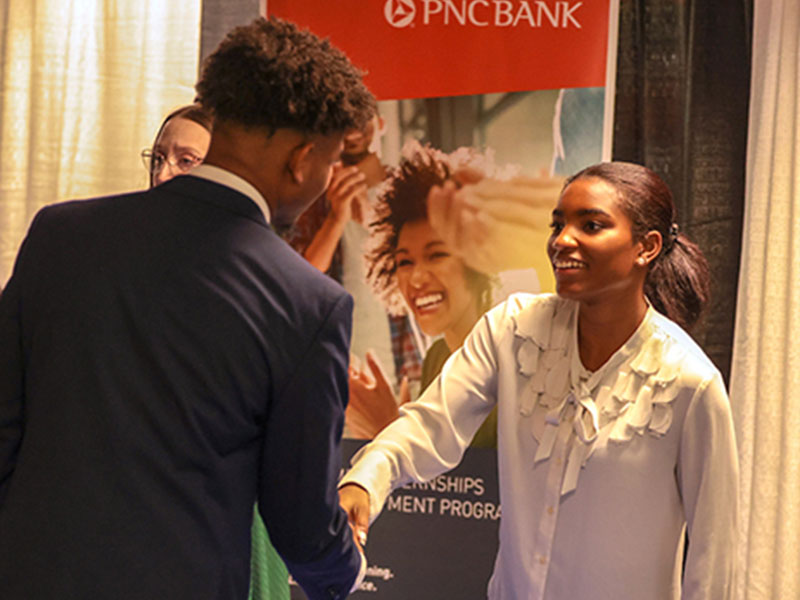 FAMU student greets a PNC Bank recruiter at the Career Expo. (Credit: Glenn Beil)