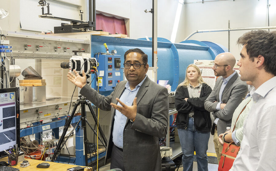 Rajan Kumar, director of the Florida Center for Advanced Aero-Propulsion, leads a tour of the facility during the AEROMORPH Center of Excellence kickoff event. (Jonas Gustavsson/Florida Center for Advanced Aero-Propulsion) 