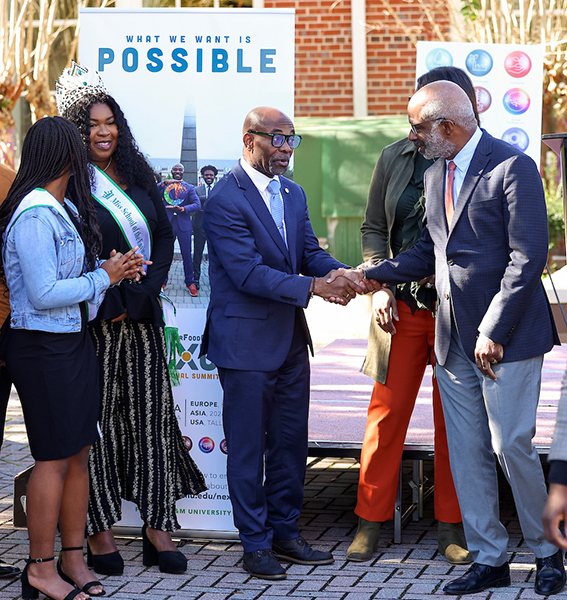 School of the Environment Dean Victor Ibeanusi greets President Robinson during the March 2024 announcement of upcoming Durban Summit. 