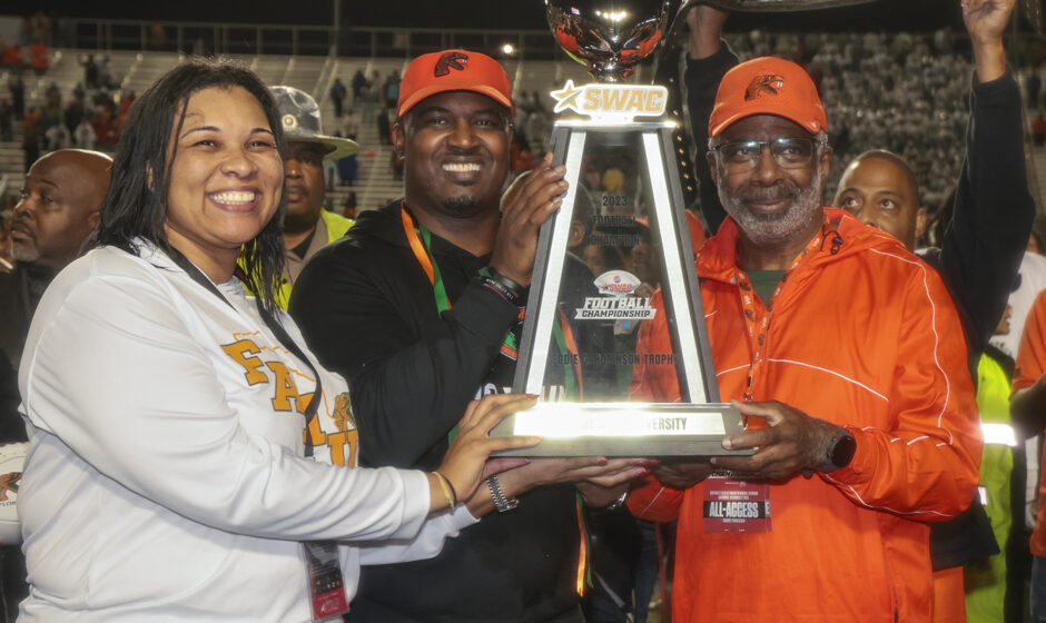 VP/AD Tiffani-Dawn Sykes, Coach Simmons and President Robinson hold SWAC Championship Trophy