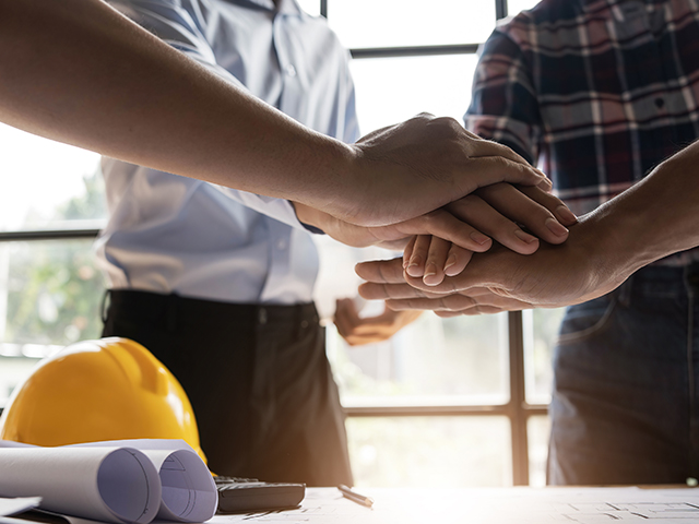 Safety Committee Team of engineer and architects working join hands to build successful projects.