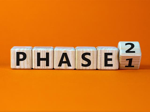 wooden blocks spelling the word "PHASE"