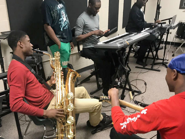 Group of students playing instruments