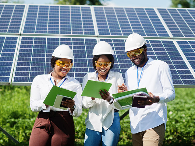 Students studying solar panels