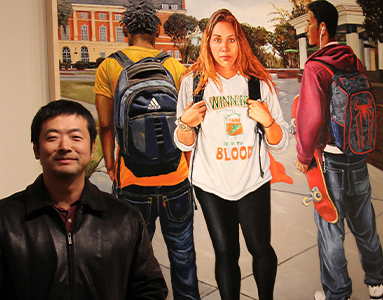 Nan Liu in front of his painting on campus