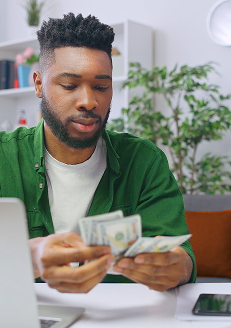 What is Financial Literacy? young man counting money