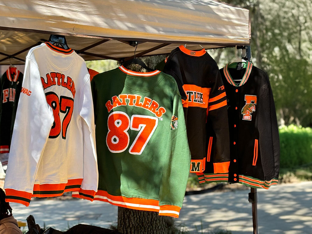 Rattler Sweaters hanging at outdoor market